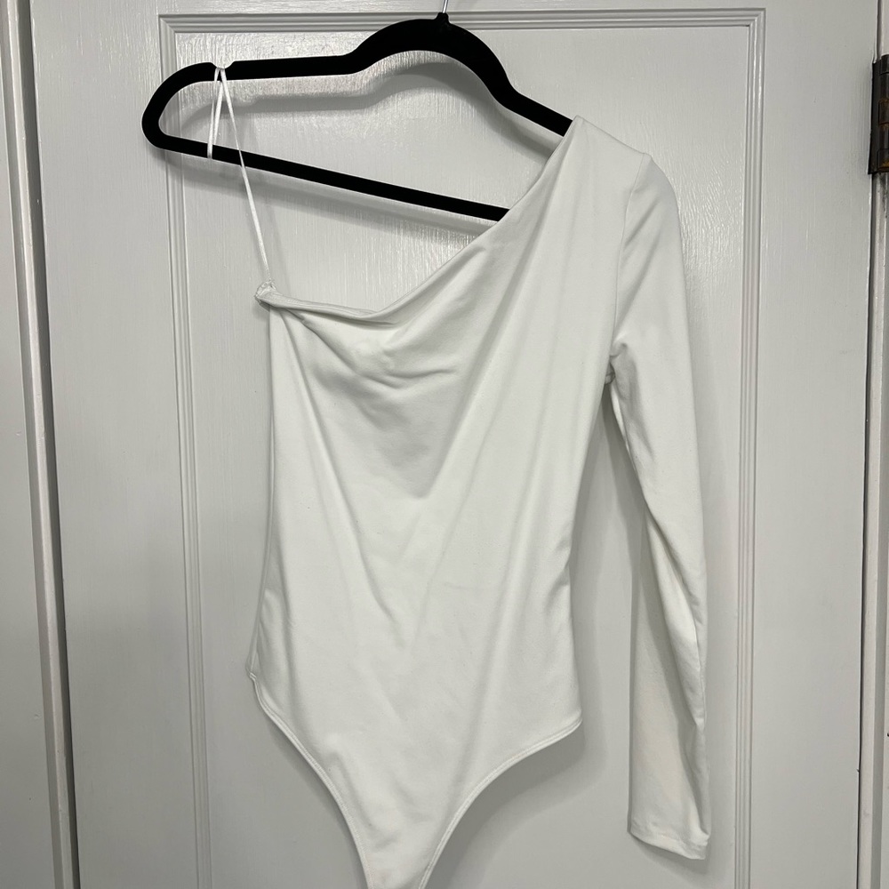White one sleeve bodysuit. Size small, like new.